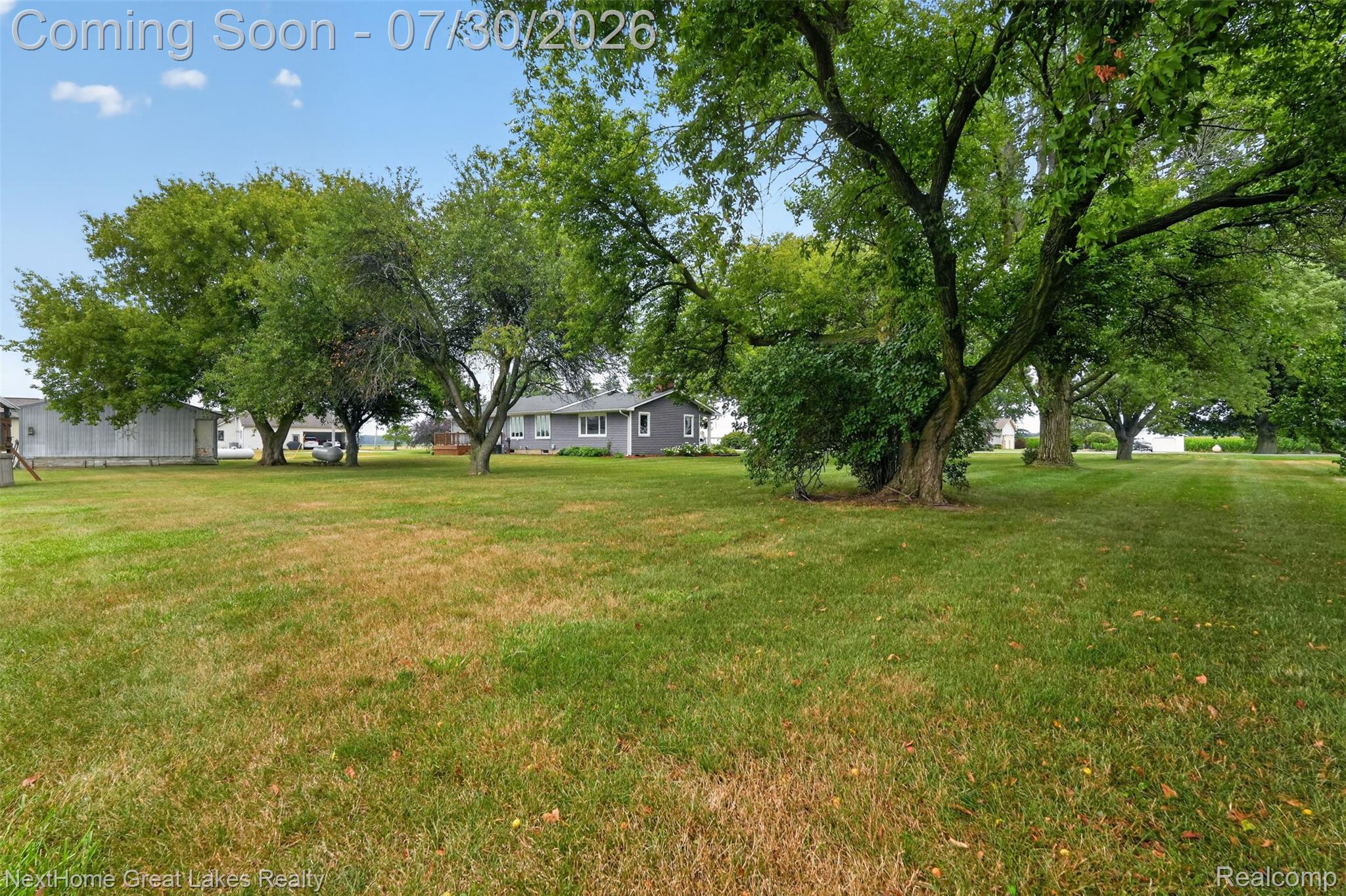 6249 North New Lothrop Road New Lothrop, MI 48460 - Photo 46 of 50 Expansive green lawn with mature trees providing extensive shade