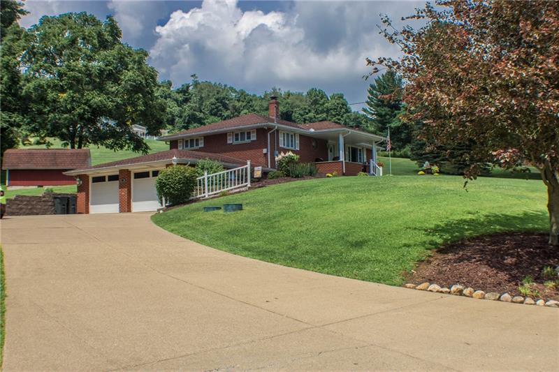 1545 McElree Road Washington, PA 15301 - Photo 2 of 24 Double concrete drive and new retaining wall.
