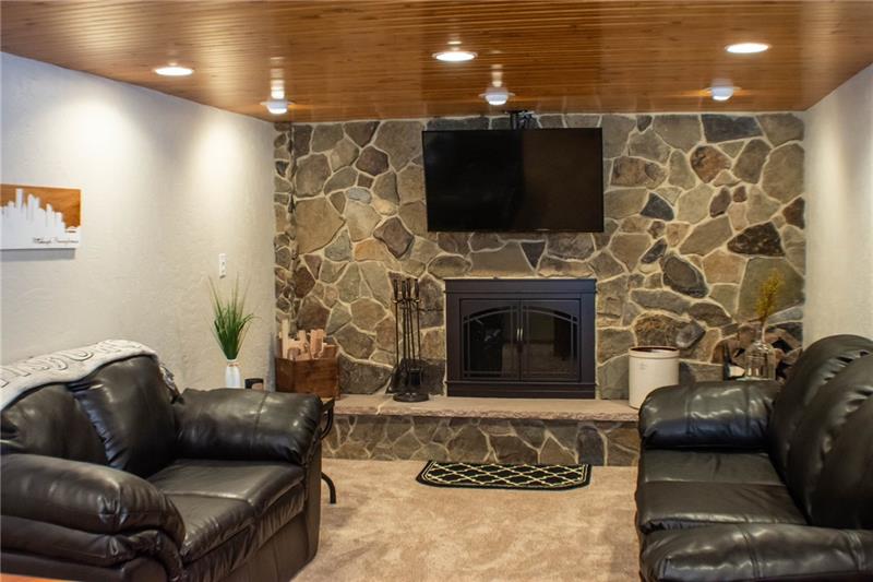 1545 McElree Road Washington, PA 15301 - Photo 13 of 24 New Lower level Family room with log burning fireplace. 23x11