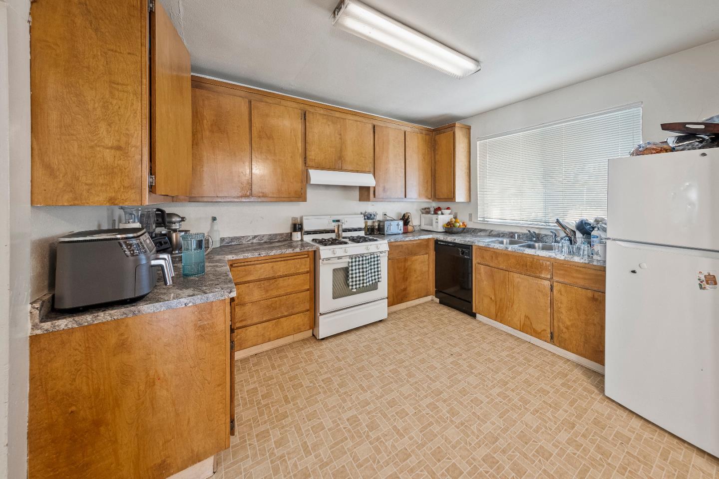 586 Monterey Road Morgan Hill, CA 95037 - Photo 13 of 16 a kitchen with stainless steel appliances granite countertop a stove sink and cabinets