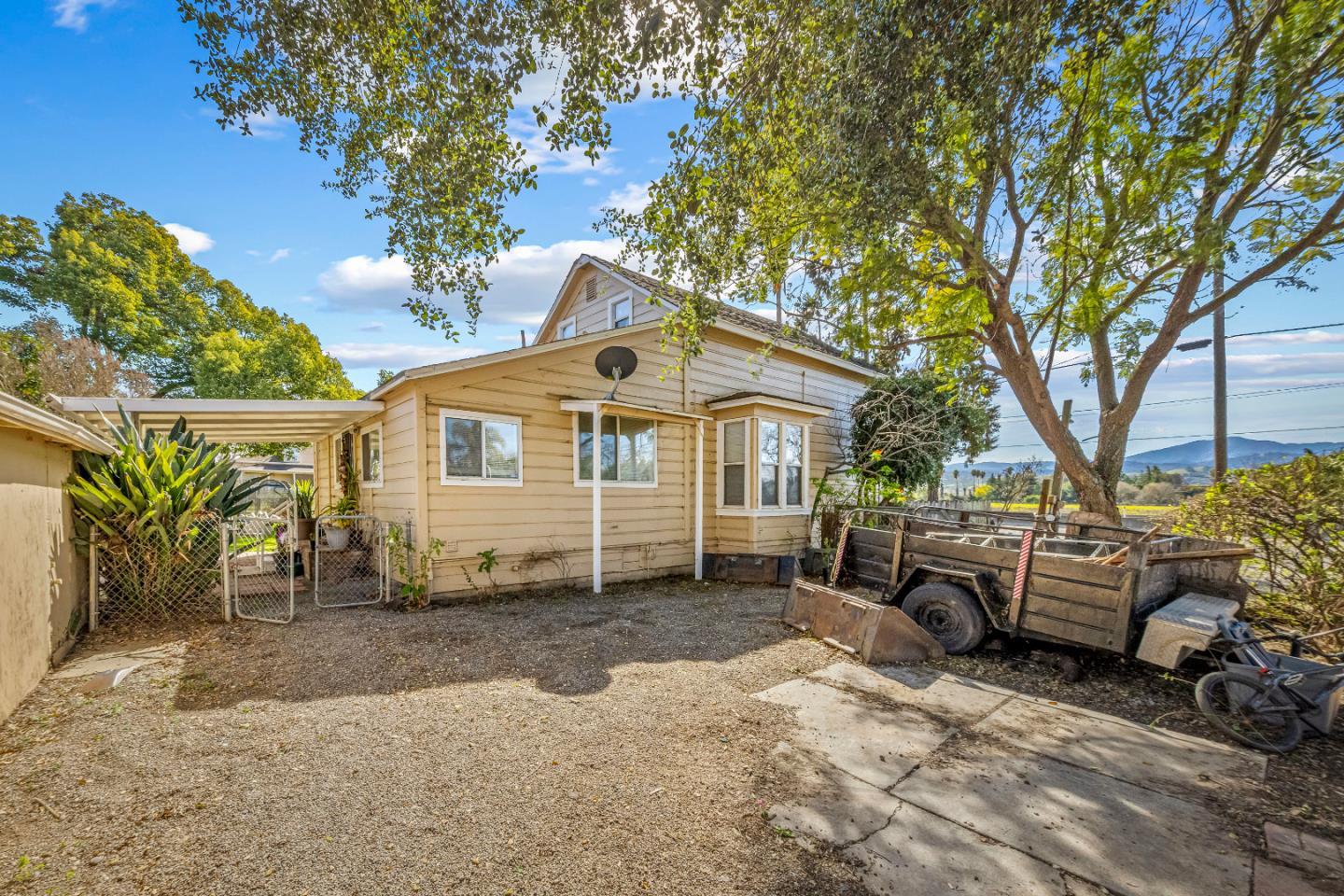 586 Monterey Road Morgan Hill, CA 95037 - Photo 2 of 16 a front view of a house with a yard and garage