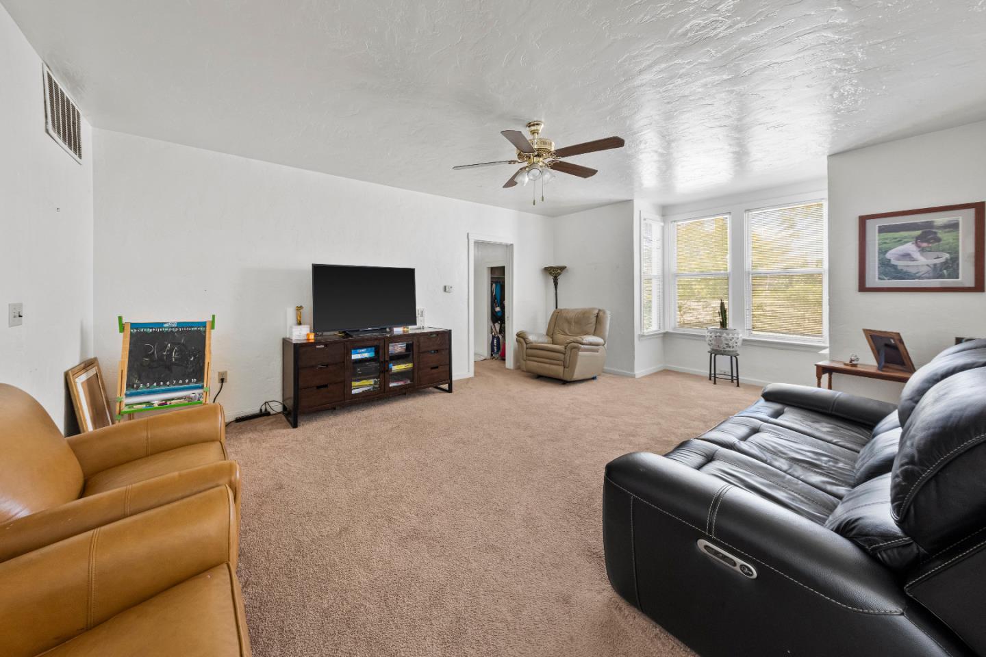 586 Monterey Road Morgan Hill, CA 95037 - Photo 10 of 16 a living room with furniture and a flat screen tv