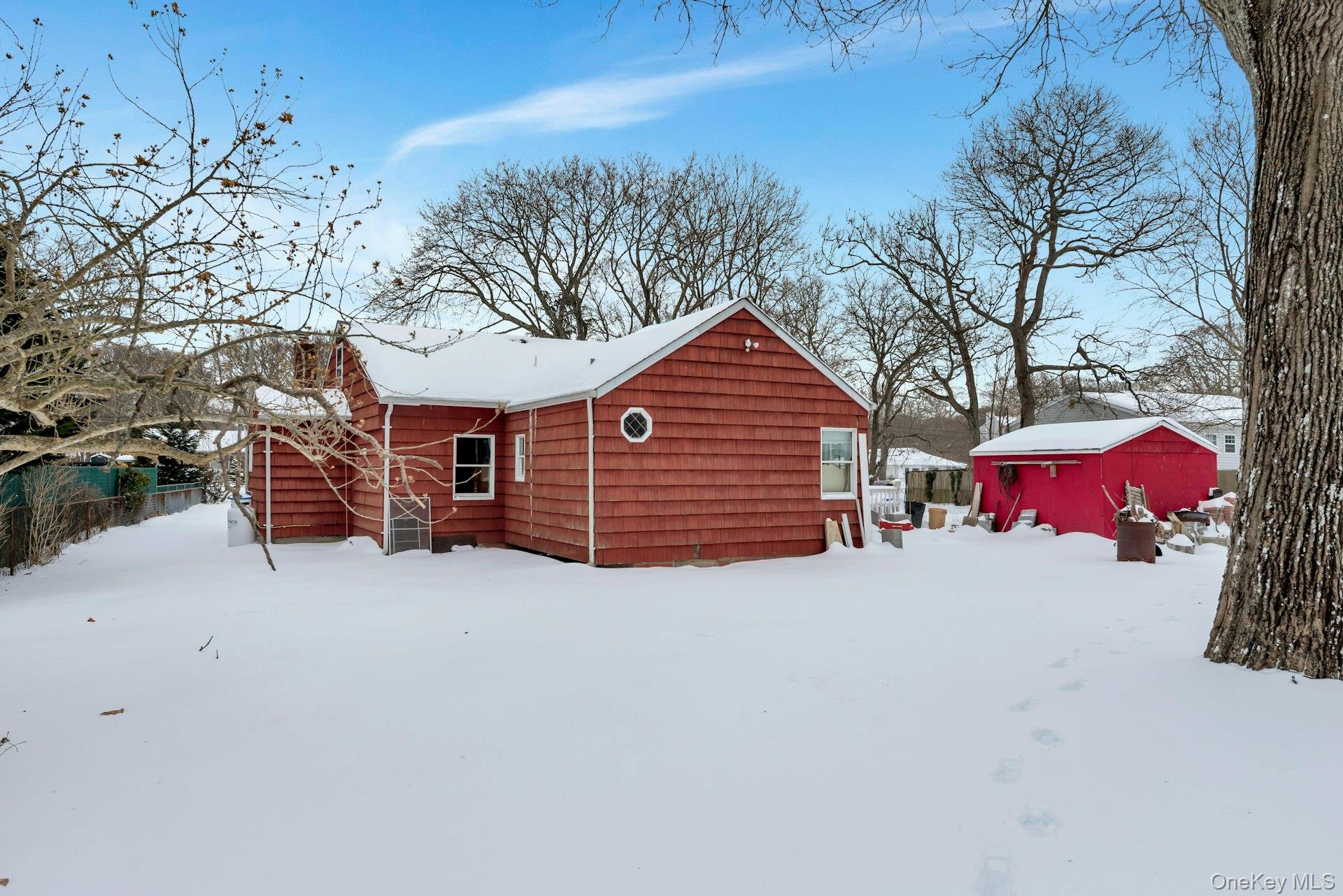 32 Stackyard Drive Mastic Beach, NY 11951 - Photo 11 of 25 a front view of a house with a yard