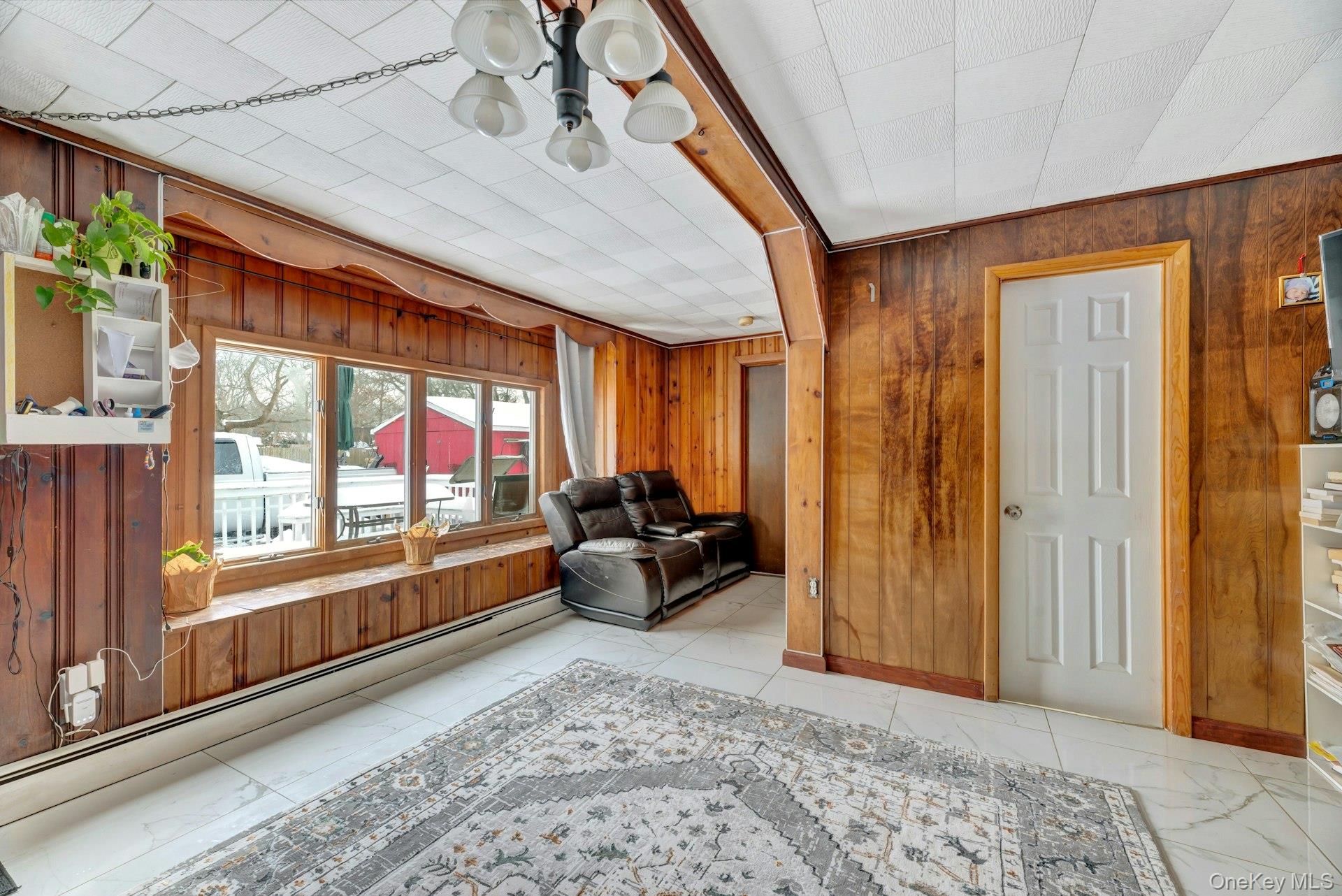 32 Stackyard Drive Mastic Beach, NY 11951 - Photo 12 of 25 a living room with furniture and a large window