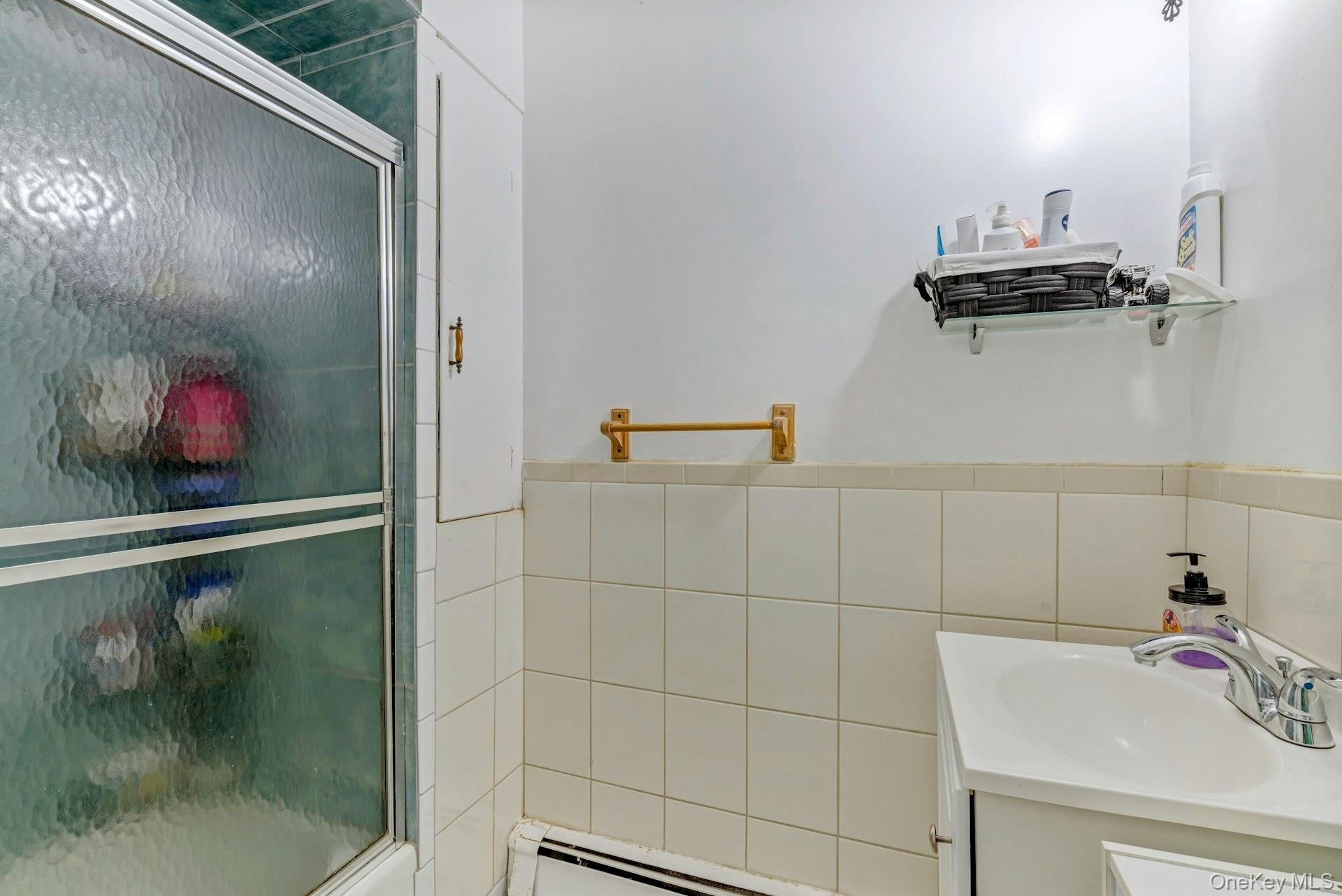 32 Stackyard Drive Mastic Beach, NY 11951 - Photo 13 of 25 a bathroom with a shower