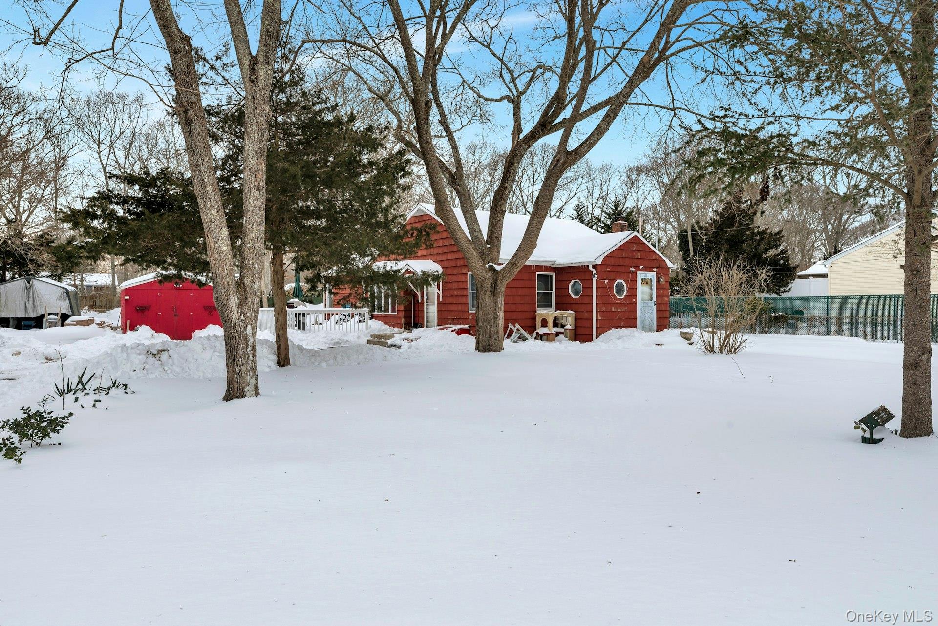 32 Stackyard Drive Mastic Beach, NY 11951 - Photo 2 of 25 a street view with large trees