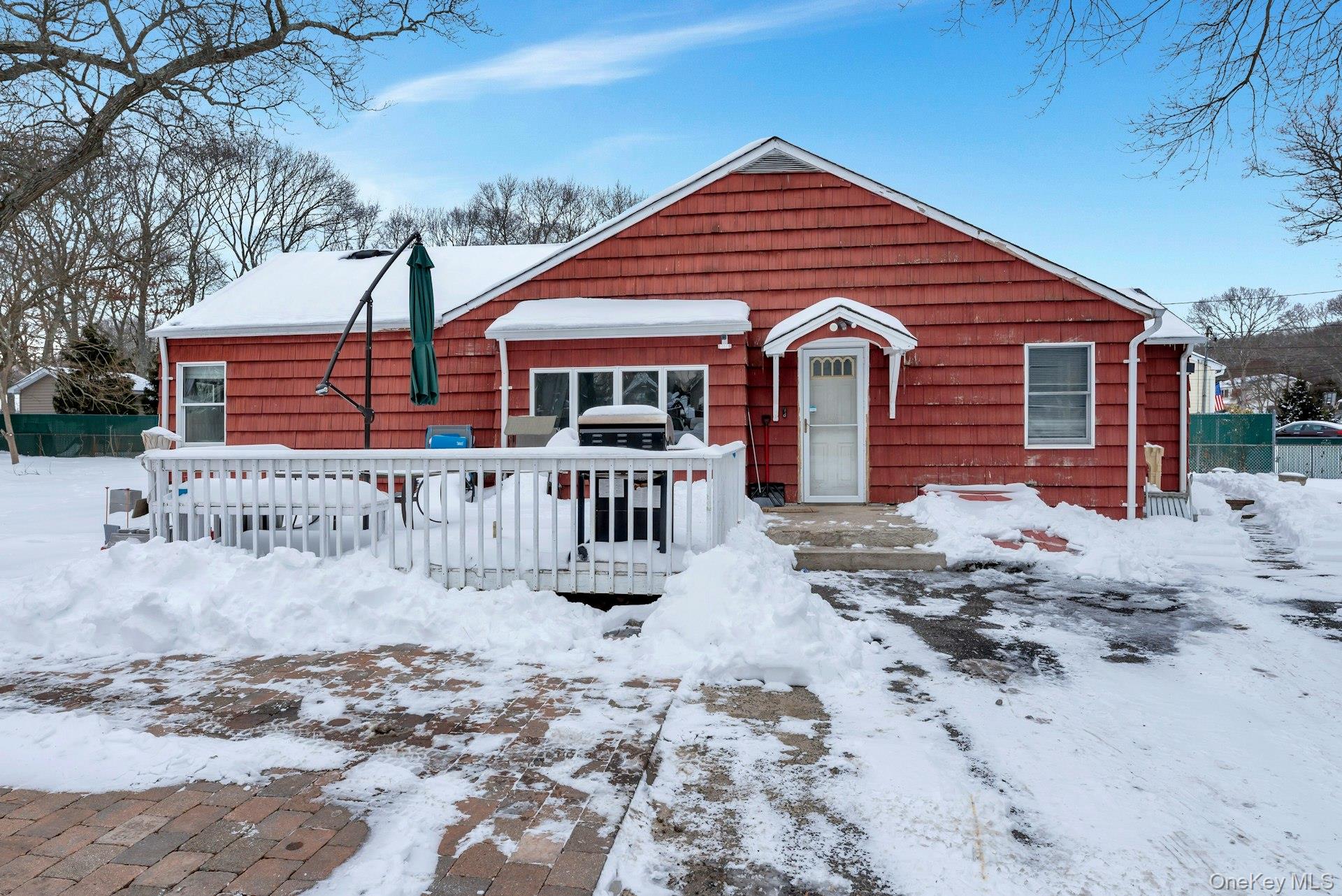 32 Stackyard Drive Mastic Beach, NY 11951 - Photo 4 of 25 a front view of a house with a yard