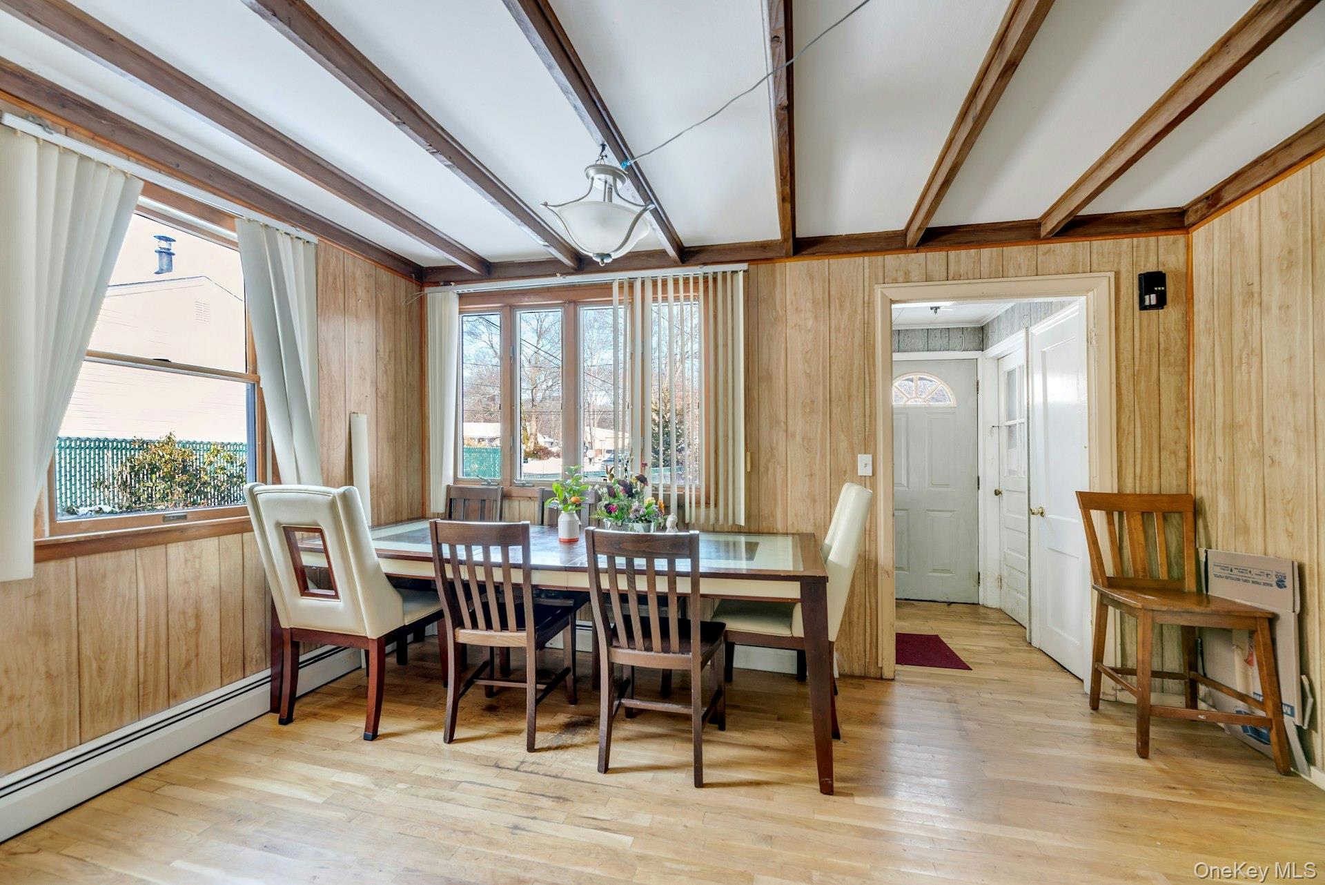 32 Stackyard Drive Mastic Beach, NY 11951 - Photo 6 of 25 a view of a dining room with furniture window and wooden floor