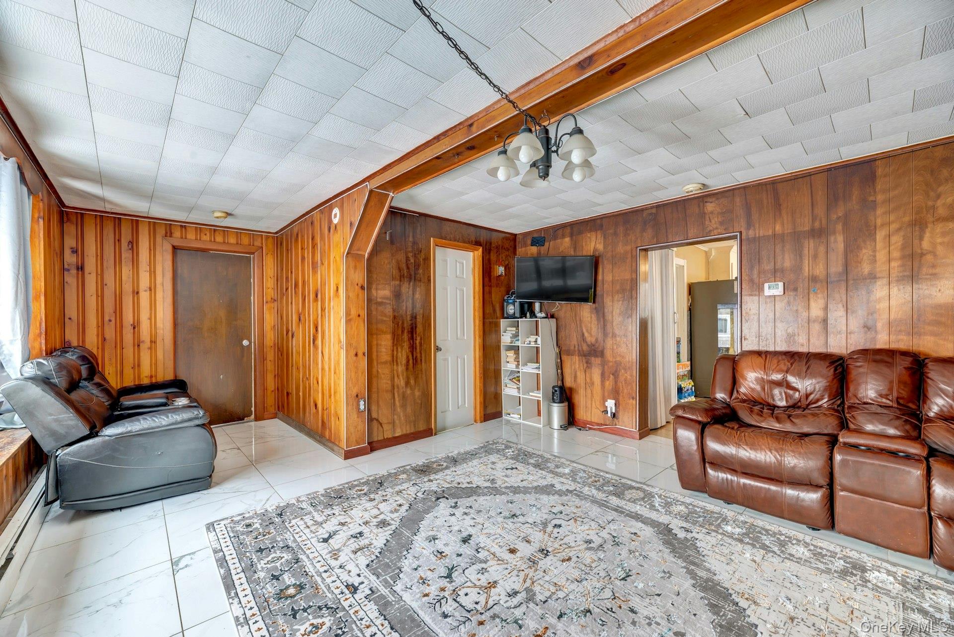 32 Stackyard Drive Mastic Beach, NY 11951 - Photo 9 of 25 a living room with furniture and wooden floor