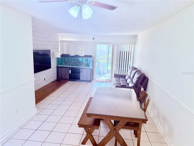 a spacious bedroom with a bed and a chandelier