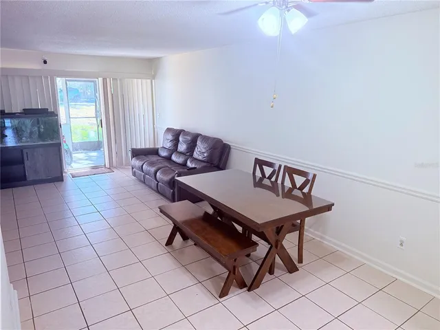 a view of a livingroom with furniture and a table