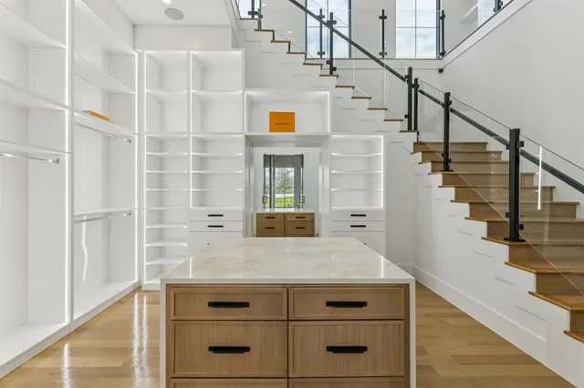 a view of a hallway with chairs