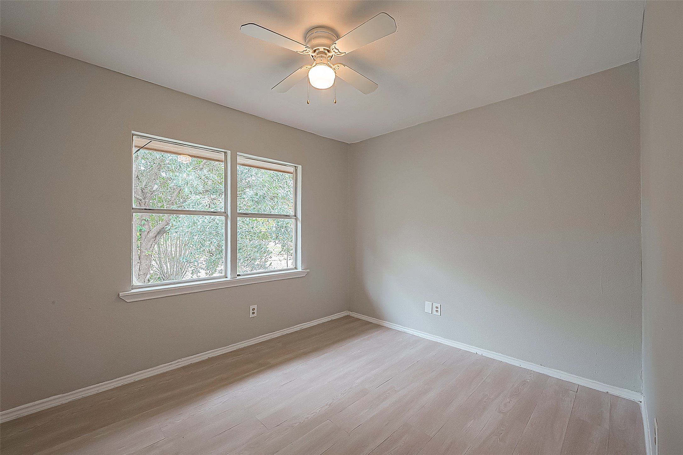 11615 Duane Street Houston, TX 77047 - Photo 13 of 14 an empty room with a window and a fan