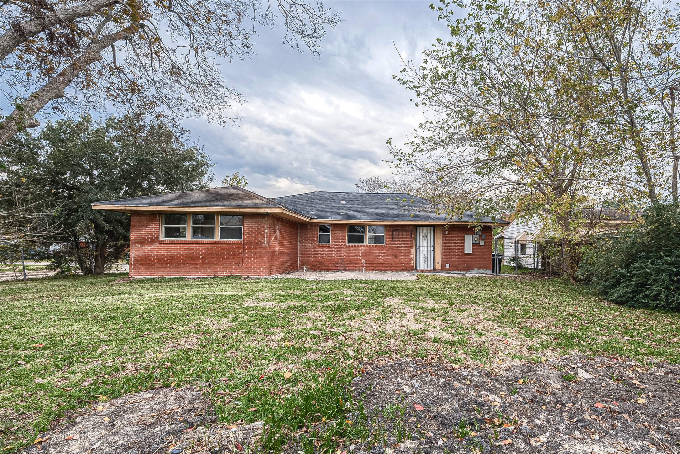 11615 Duane Street Houston, TX 77047 - Photo 14 of 14 a view of a yard in front of a house with large trees