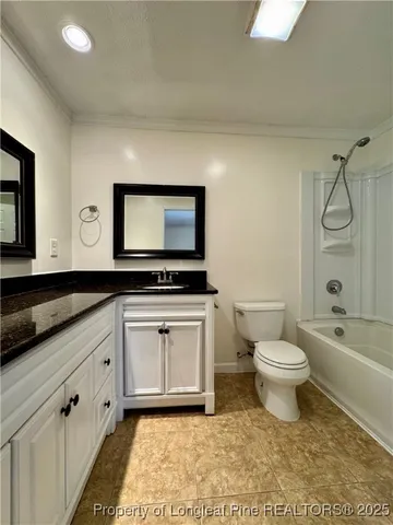 a bathroom with a toilet a sink and a bathtub
