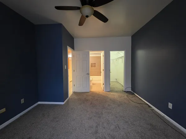 an empty room with a empty space and windows