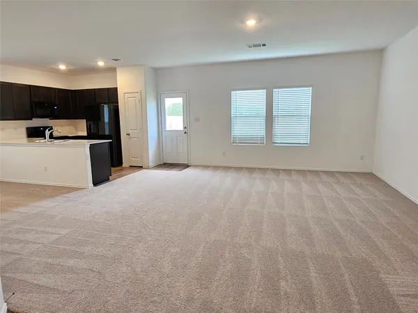 a view of kitchen with furniture and window