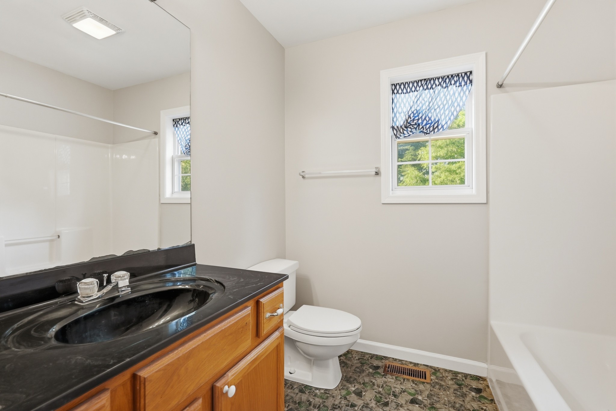 4877 Swafford Road Cookeville, TN 38501 - Photo 13 of 28 a bathroom with a granite countertop sink toilet and a mirror