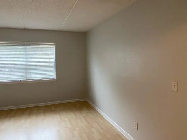 a view of kitchen with white cabinets and white appliances