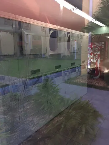 a view of a patio with table and chairs with wooden fence and floor