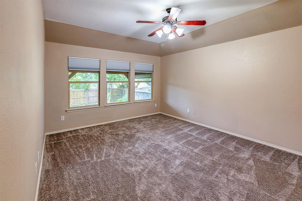 1070 Shepard Lane Lavon, TX 75166 - Photo 15 of 29 an empty room with windows and fan
