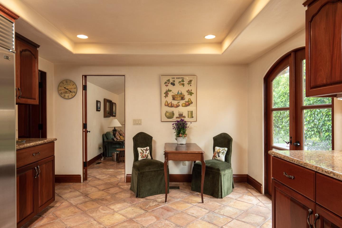 1007 Ocean Road Pebble Beach, CA 93953 - Photo 15 of 24 a living room with furniture a window and a flat screen tv