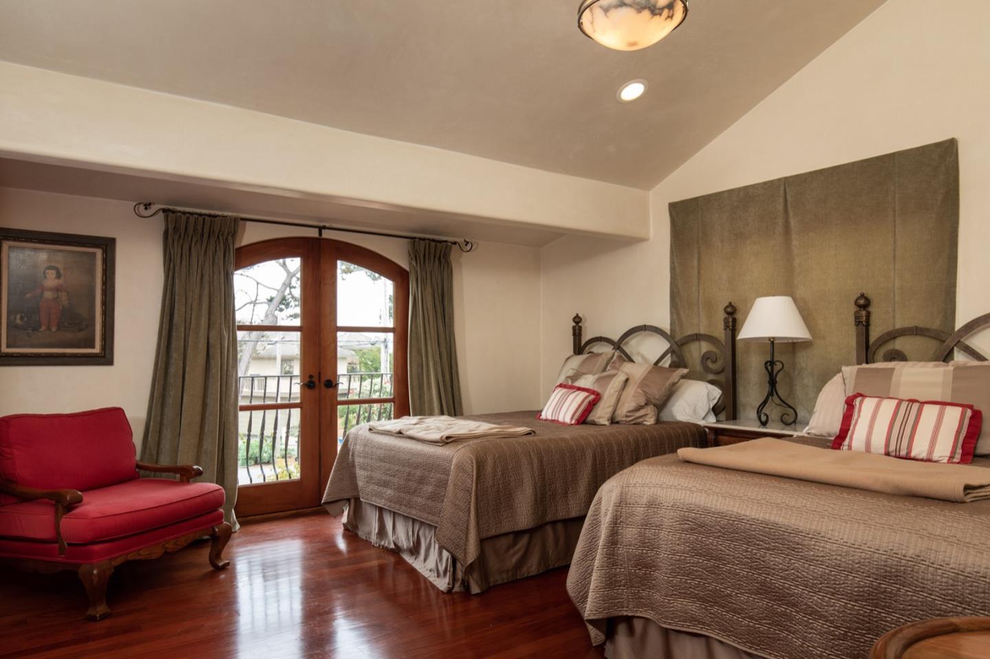1007 Ocean Road Pebble Beach, CA 93953 - Photo 24 of 24 a bedroom with two beds and a large window