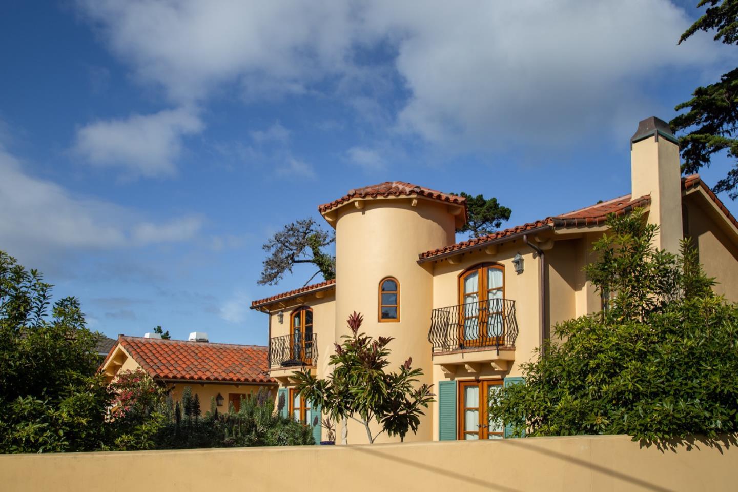 1007 Ocean Road Pebble Beach, CA 93953 - Photo 3 of 24 a front view of a house with a yard