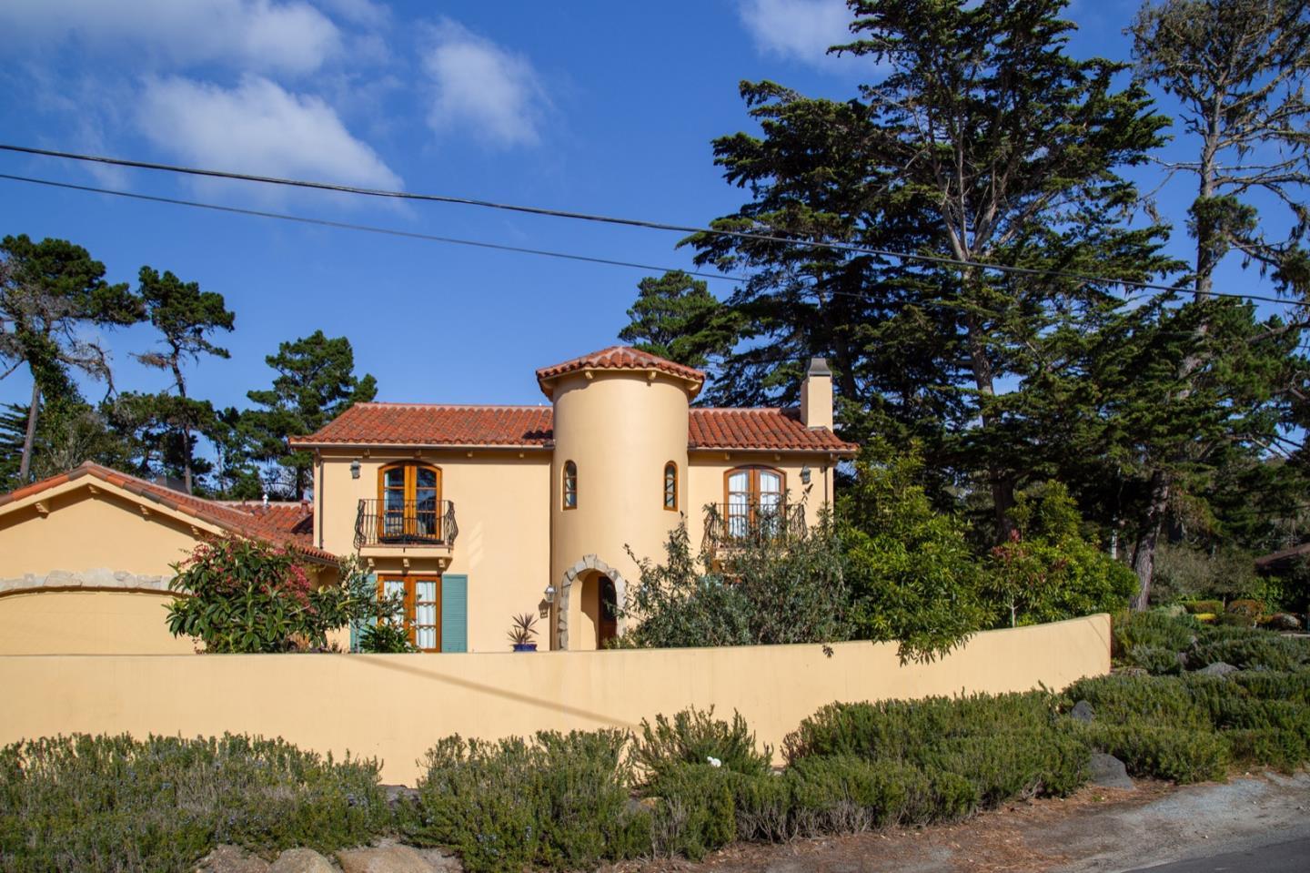 1007 Ocean Road Pebble Beach, CA 93953 - Photo 4 of 24 front view of a house with a yard