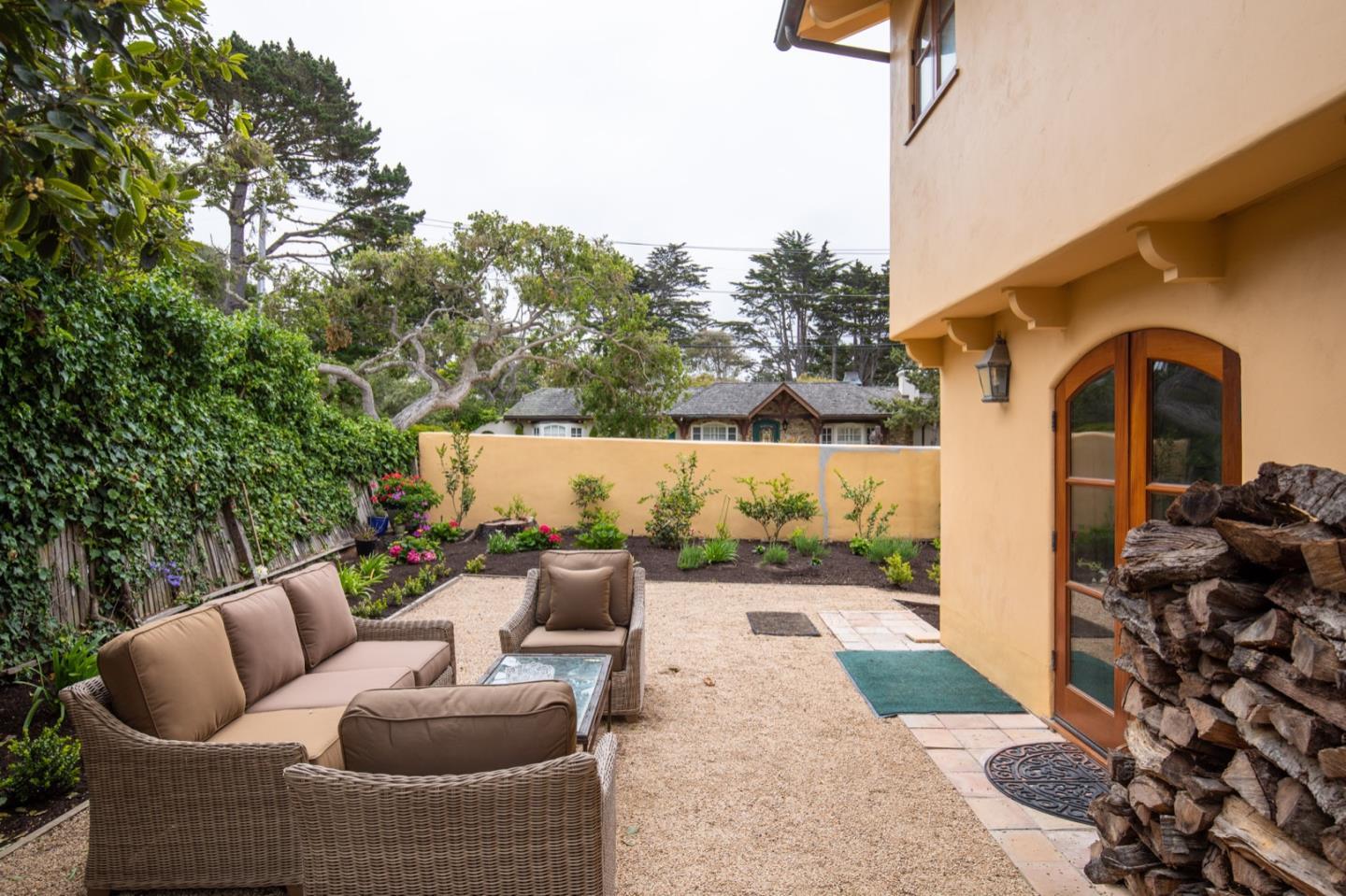 1007 Ocean Road Pebble Beach, CA 93953 - Photo 6 of 24 a outdoor living space with furniture and garden view