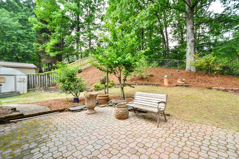 114 Due W Street Dallas, GA 30157 - Photo 27 of 32 a wooden bench sitting in the middle of a yard