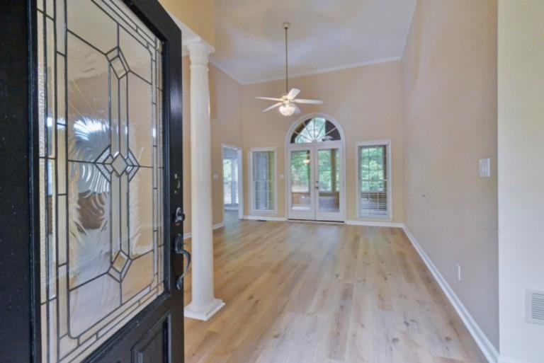 114 Due W Street Dallas, GA 30157 - Photo 3 of 32 a view of a hallway with wooden floor and a chandelier