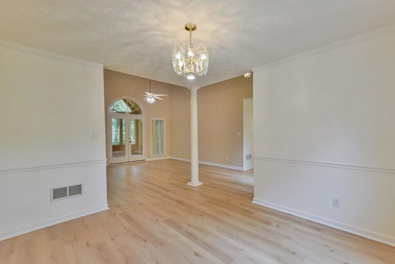 114 Due W Street Dallas, GA 30157 - Photo 5 of 32 wooden floor in an empty room with a chandelier