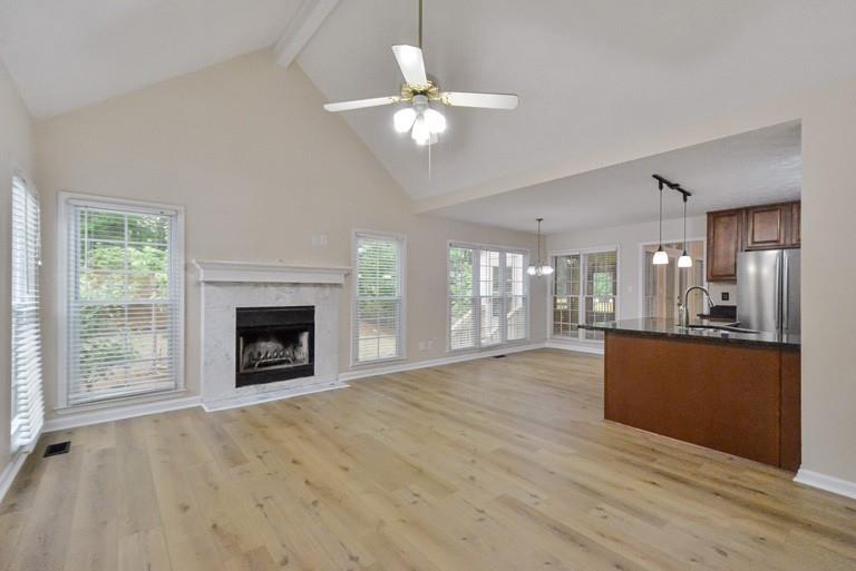 114 Due W Street Dallas, GA 30157 - Photo 7 of 32 a view of an empty room with a fireplace and a window