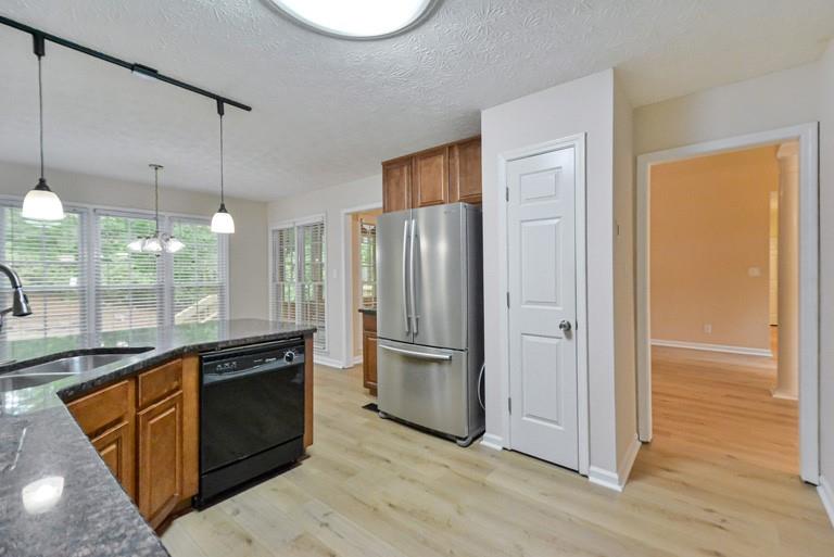 114 Due W Street Dallas, GA 30157 - Photo 9 of 32 a kitchen with stainless steel appliances granite countertop a refrigerator a sink and a stove