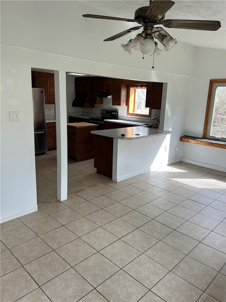 1358 Hanes Road Dayton, OH 45434 - Photo 7 of 21 This open concept kitchen and dining area features durable tile flooring and abundant natural light.