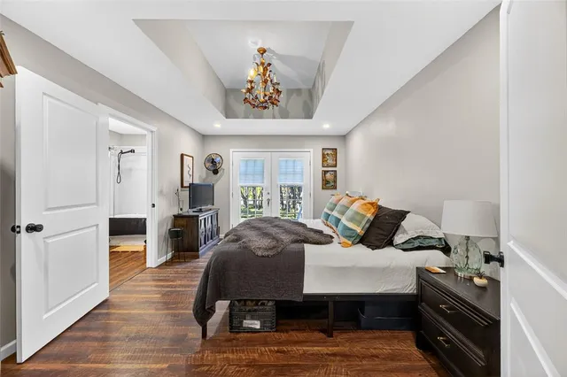 a bedroom with furniture and a wooden floor