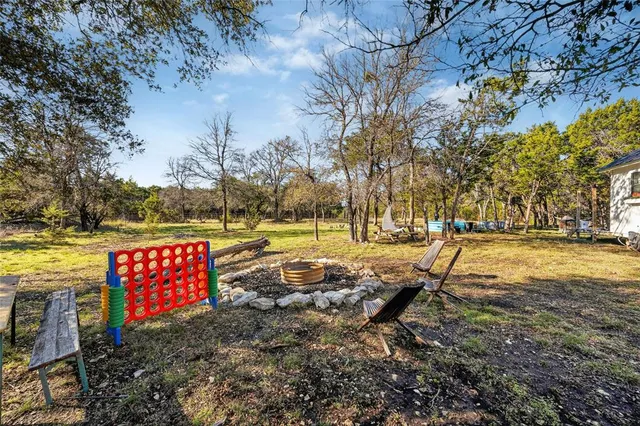 a view of outdoor space with swimming pool and sitting area