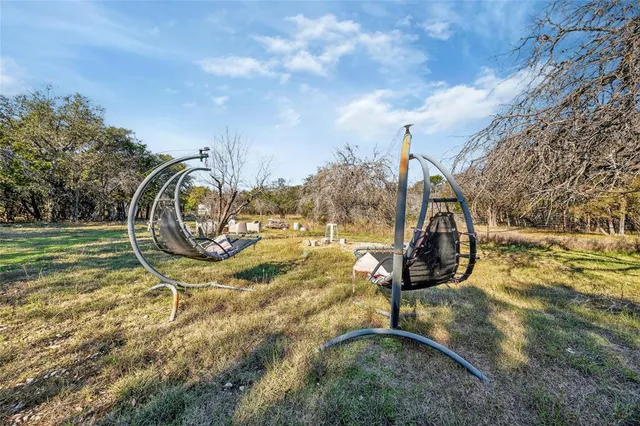 a view of a park with iron fence