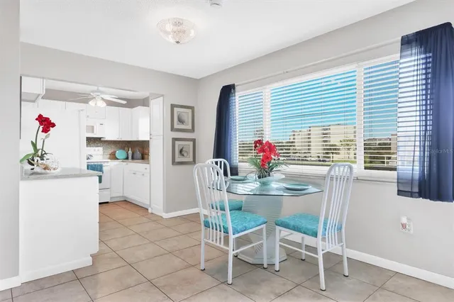 a kitchen with granite countertop furniture and a dining table