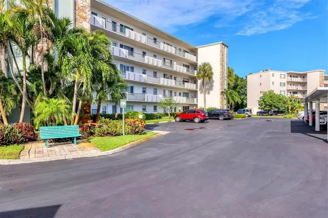 a view of a street with cars on city street