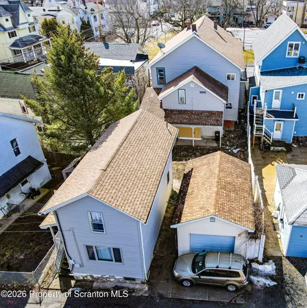 an aerial view of residential houses with outdoor space