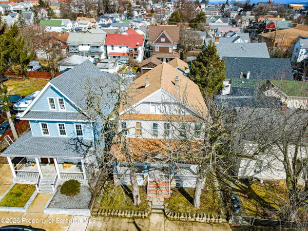 a view of entryway with window and wooden floor