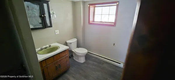 an empty room with windows and entrance