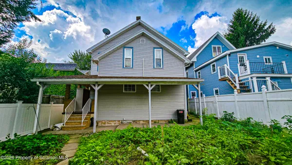 a kitchen with cabinets appliances and a window