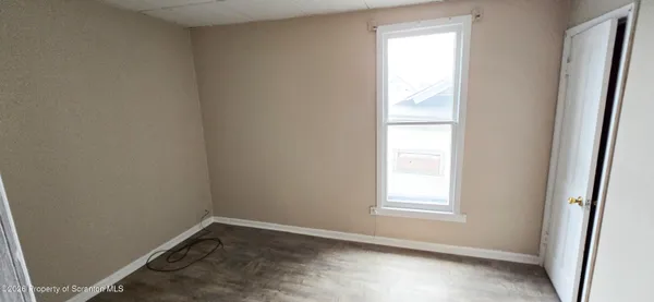 a view of a hallway with stairs