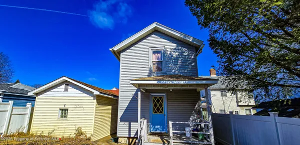 a kitchen with a refrigerator and a stove