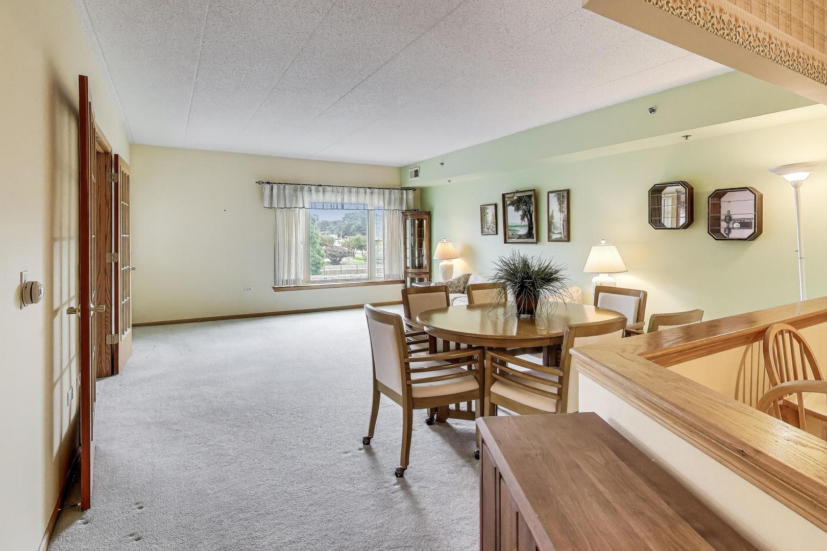 1200 South Prospect Avenue, Unit 108 Elmhurst, IL 60126 - Photo 6 of 19 a living room with furniture and a wooden floor
