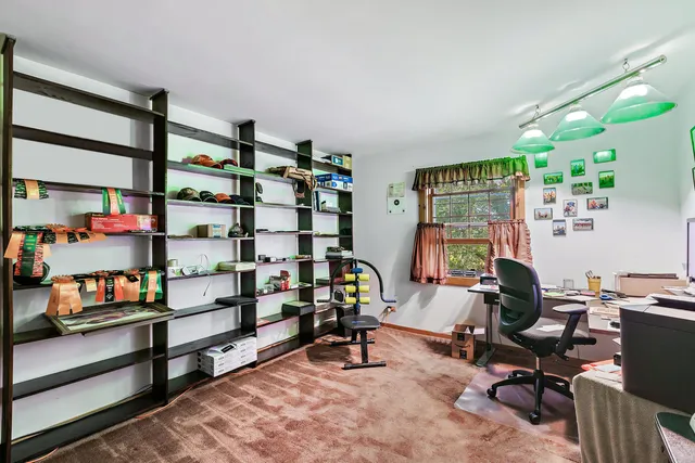 a view of a workspace with furniture