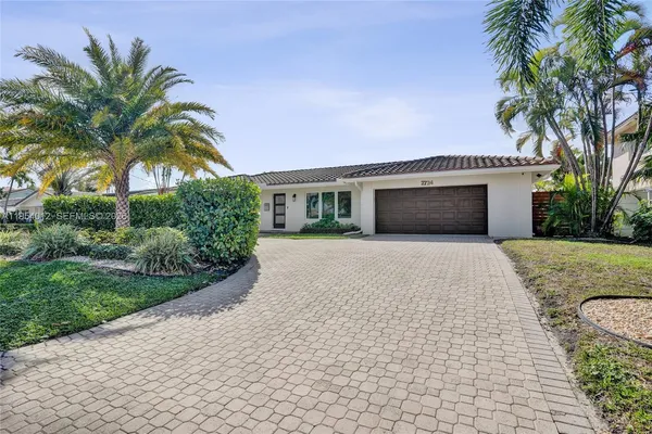 a house with palm tree in front of it